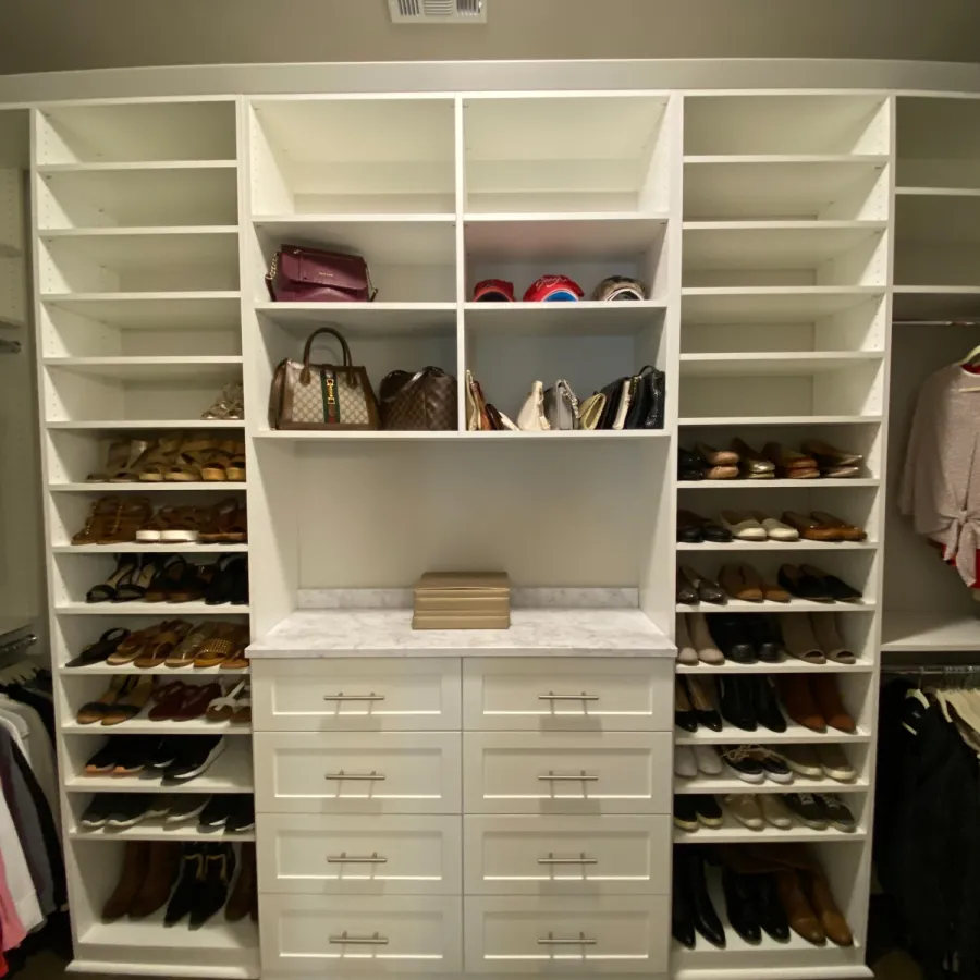 a white shelving unit with drawers