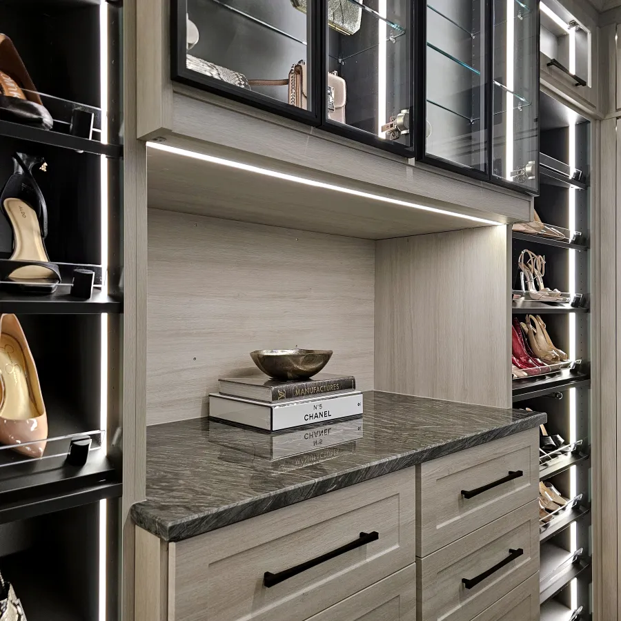 a kitchen with a shelf and a glass cabinet