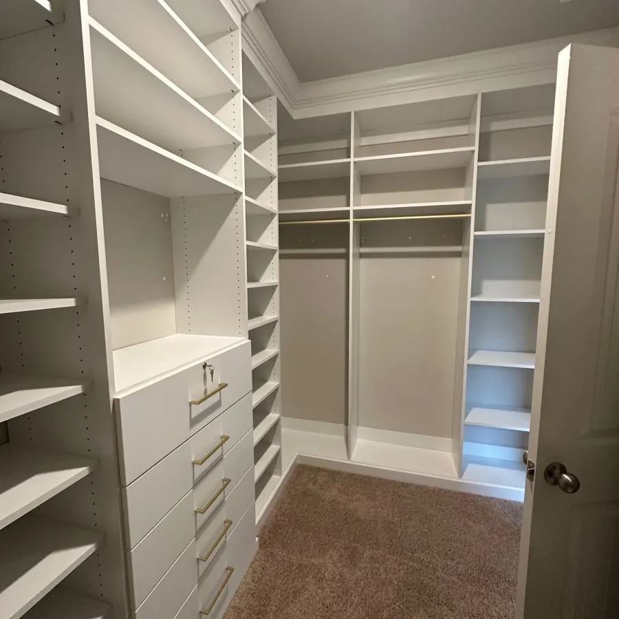 a room with white shelves