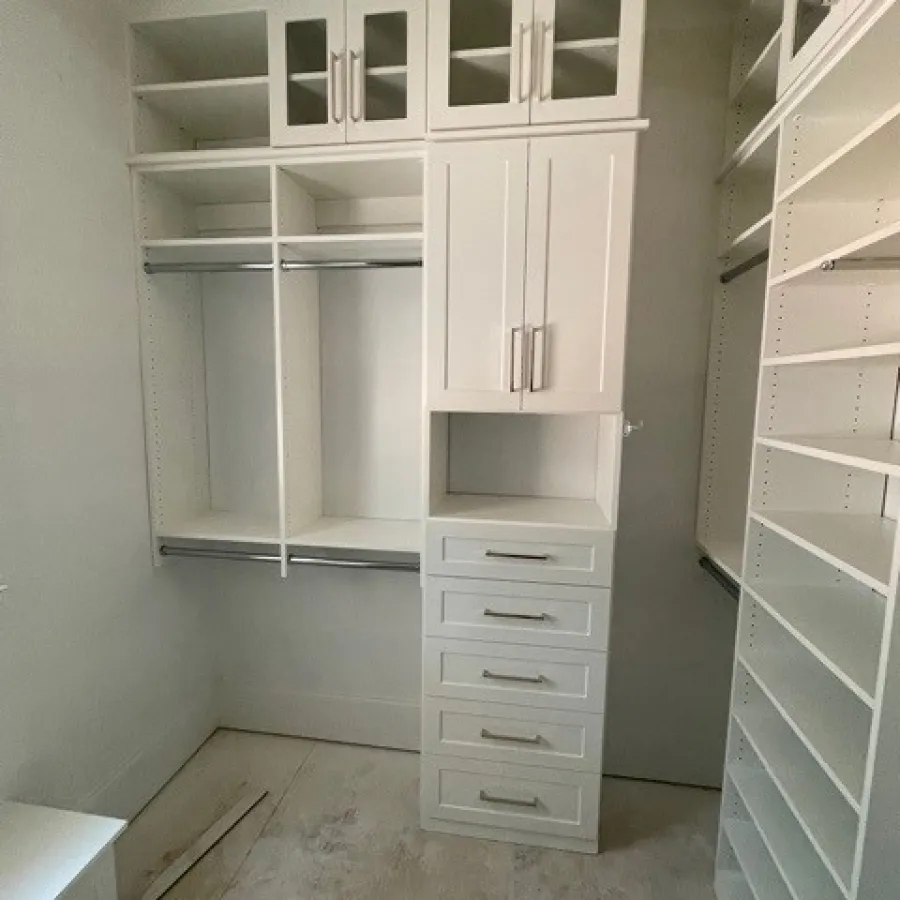 a white cabinet with white drawers