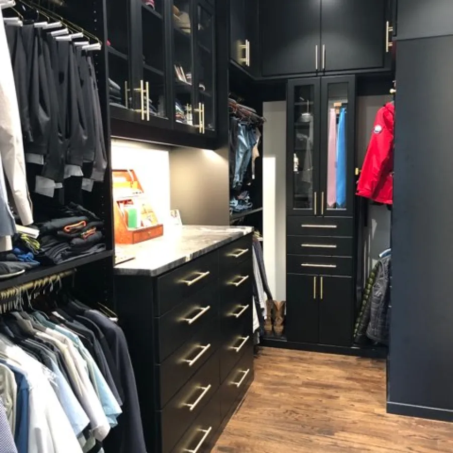 a room with black cabinets and black cabinets