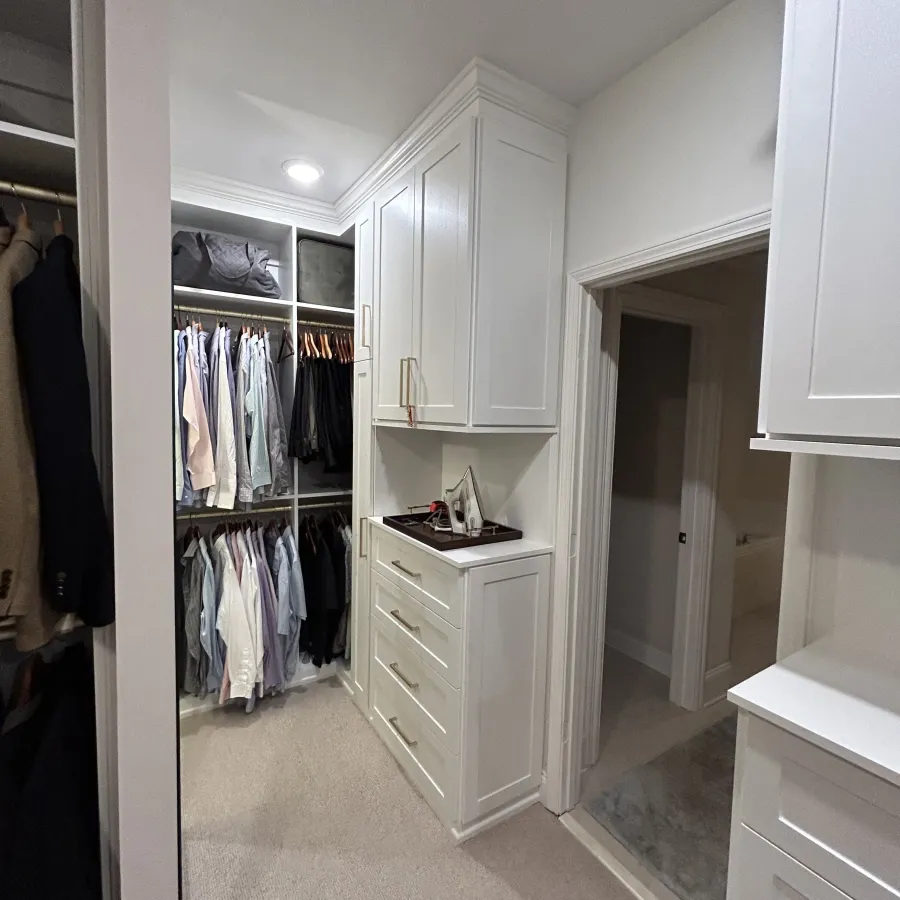 a closet with clothes