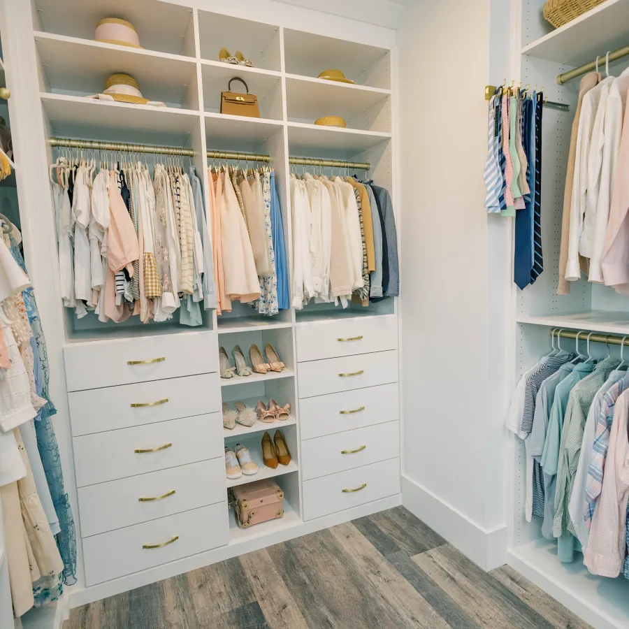 a closet with clothes and clothes