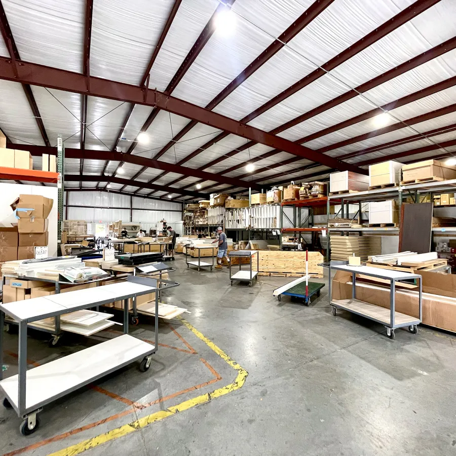 a warehouse with tables and chairs