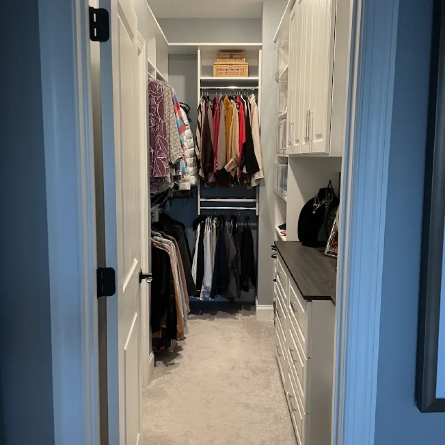 a closet with clothes