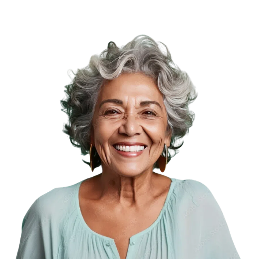 Smiling elderly woman with curly silver hair wearing light blue blouse and gold earrings against black background