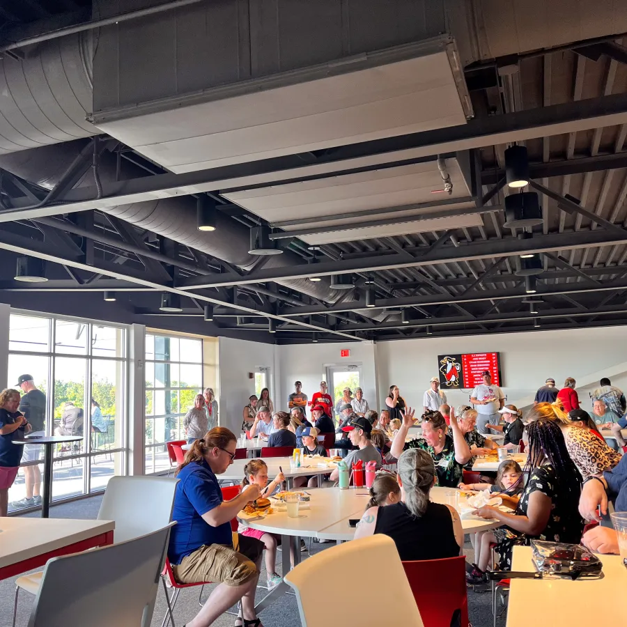 a group of people sitting at tables