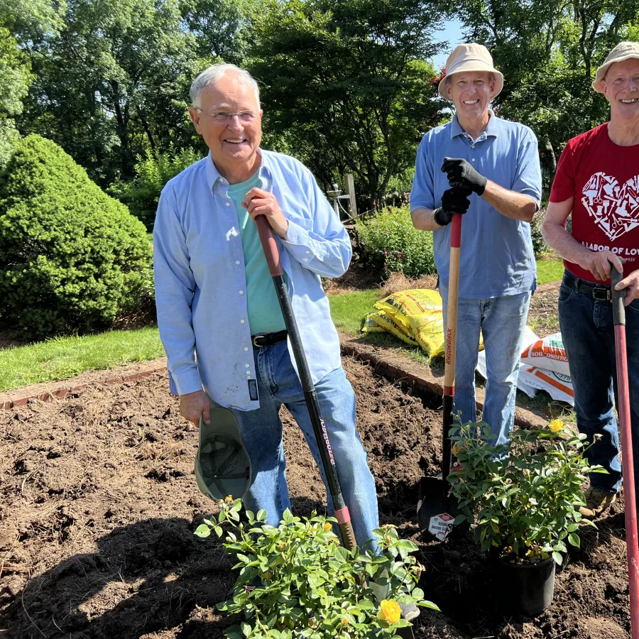 a few men working in a garden