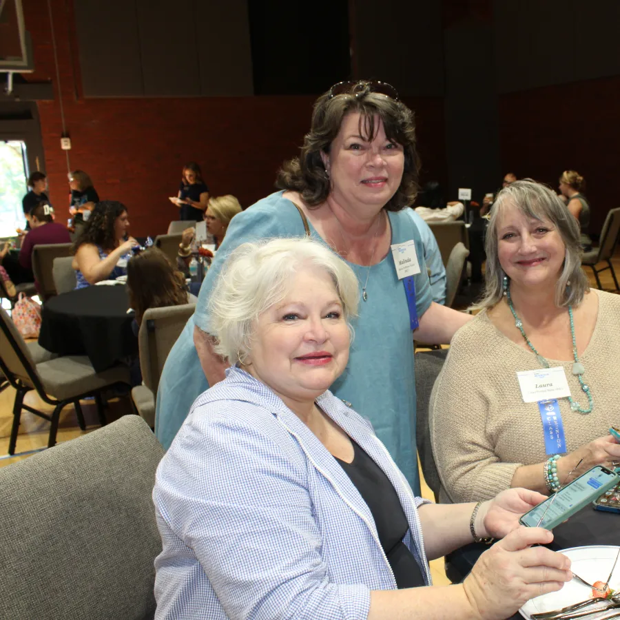 a group of women sitting at a table