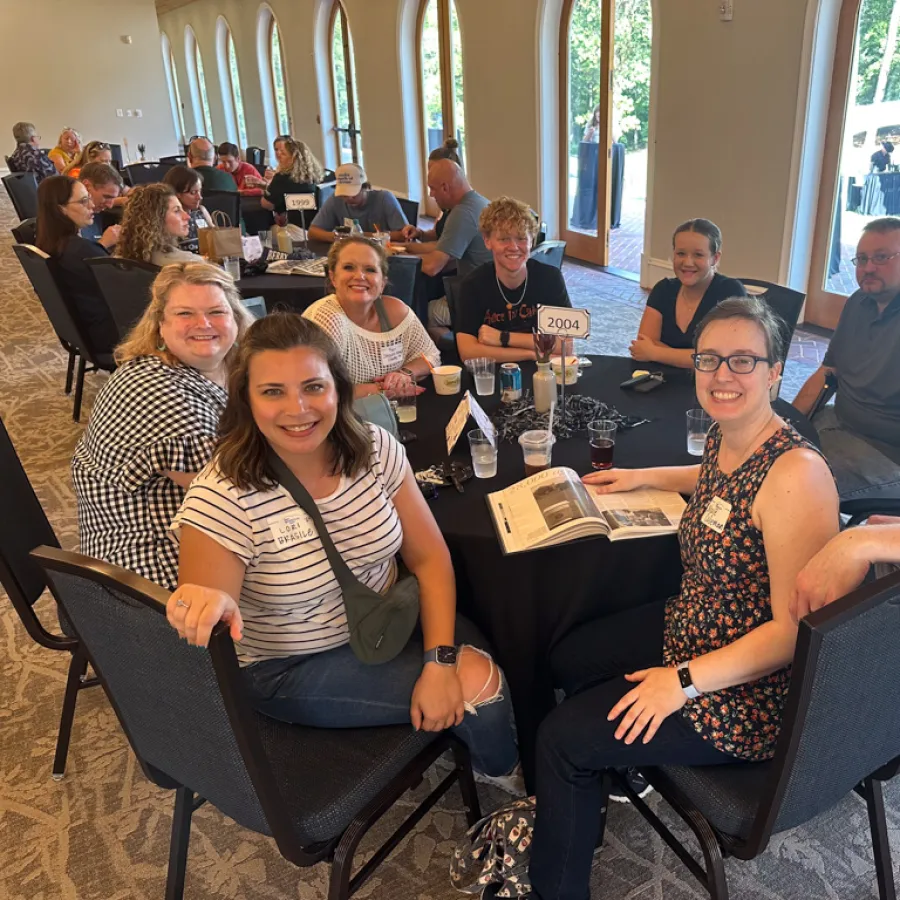 a group of people sitting around a table