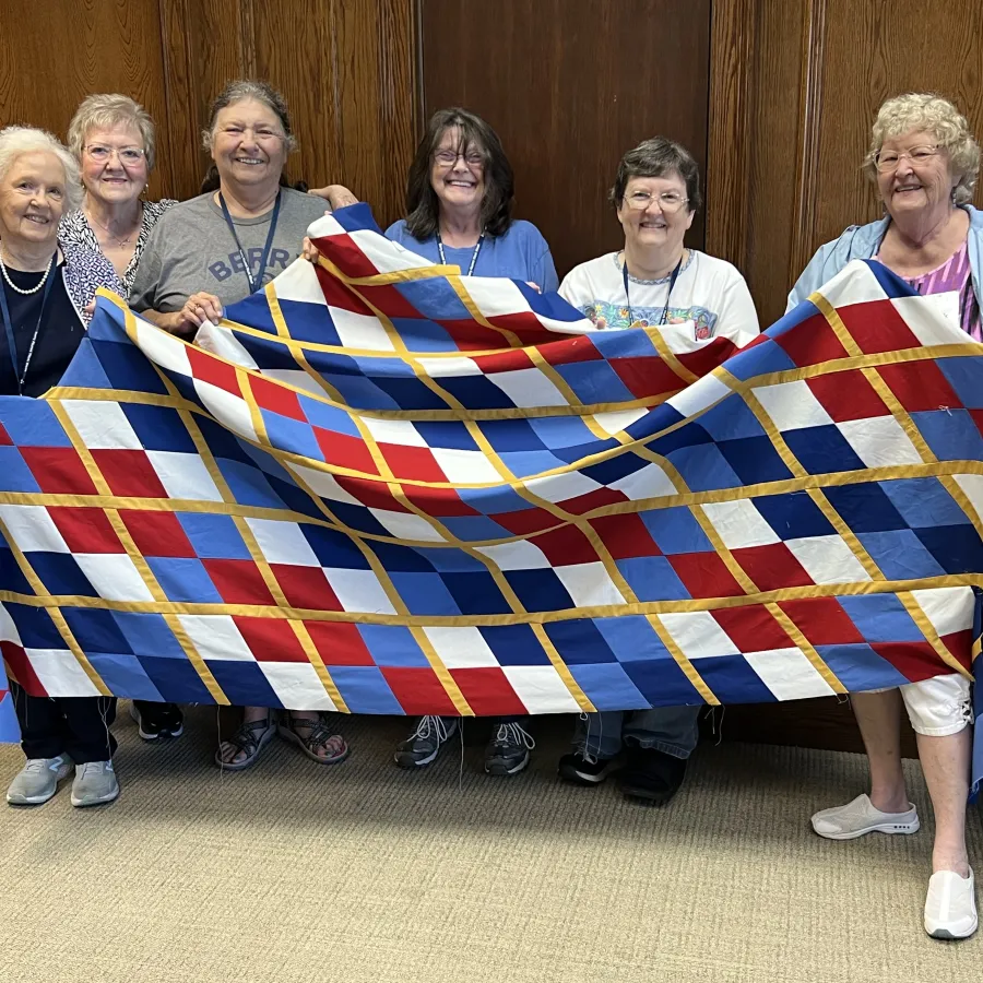 a group of people holding a flag