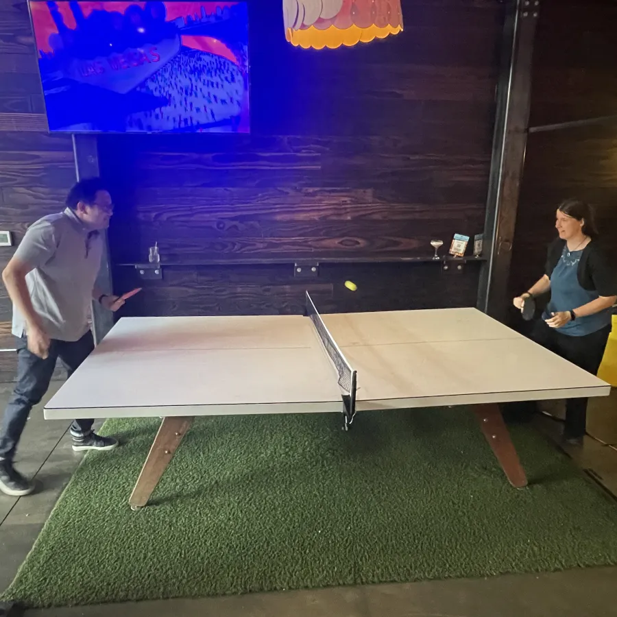 a man and a woman playing pool