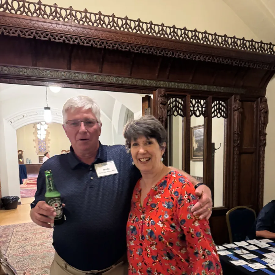 a man and woman holding bottles