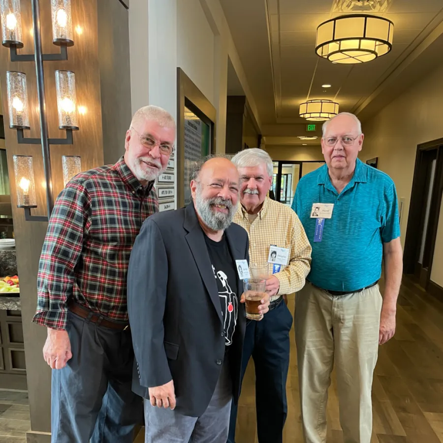 a group of men posing for a photo