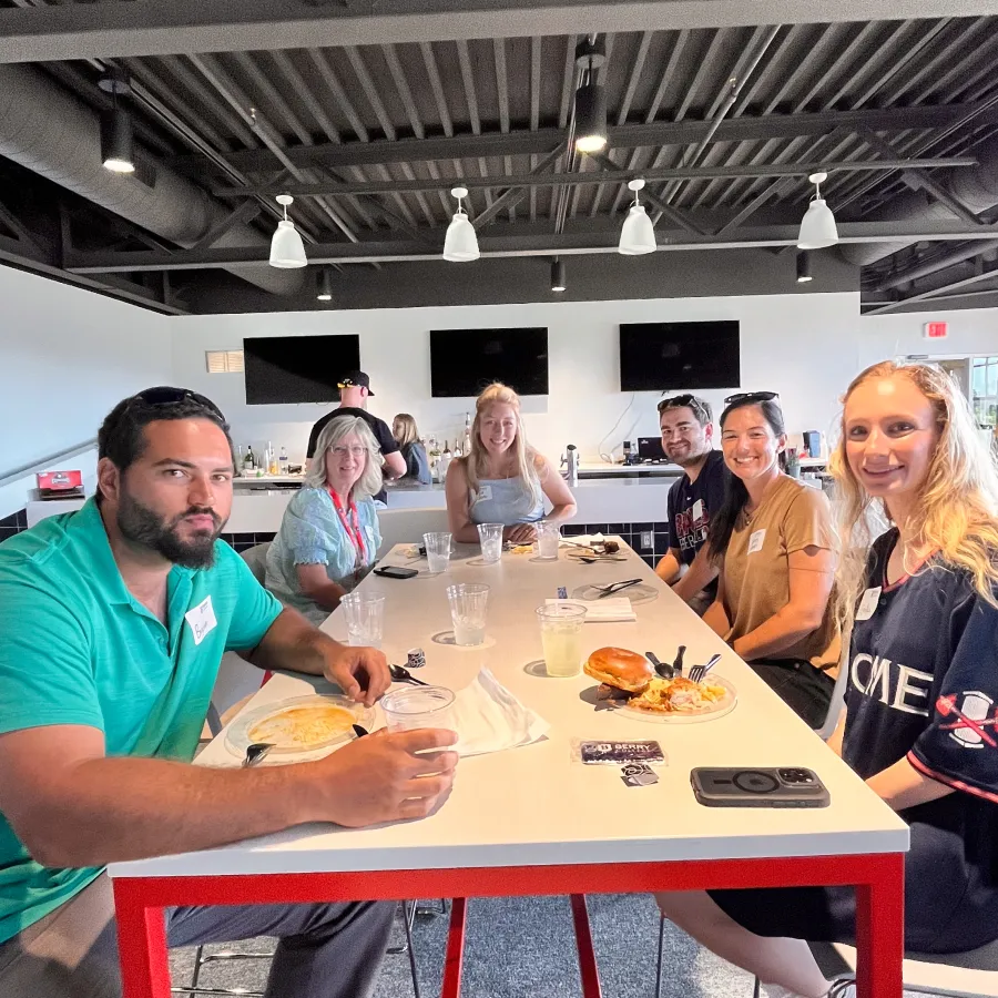 a group of people eating at a table