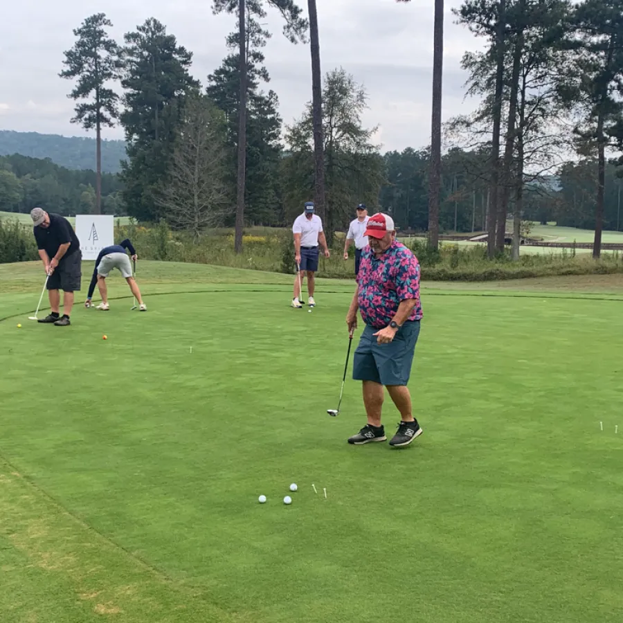 a group of people playing golf