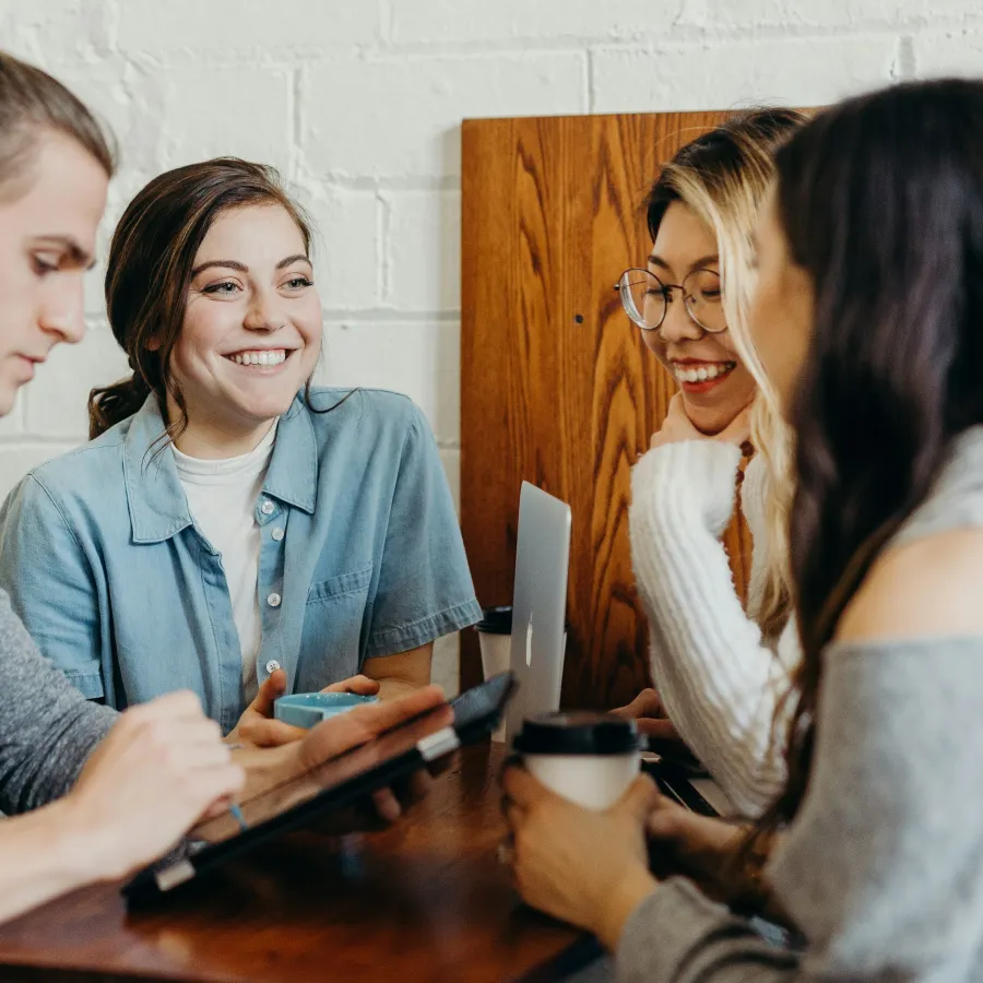 a group of women sitting at a table