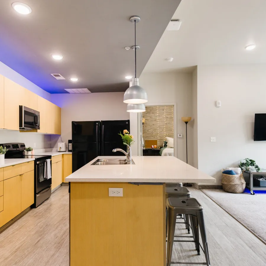 a kitchen with a bar stool