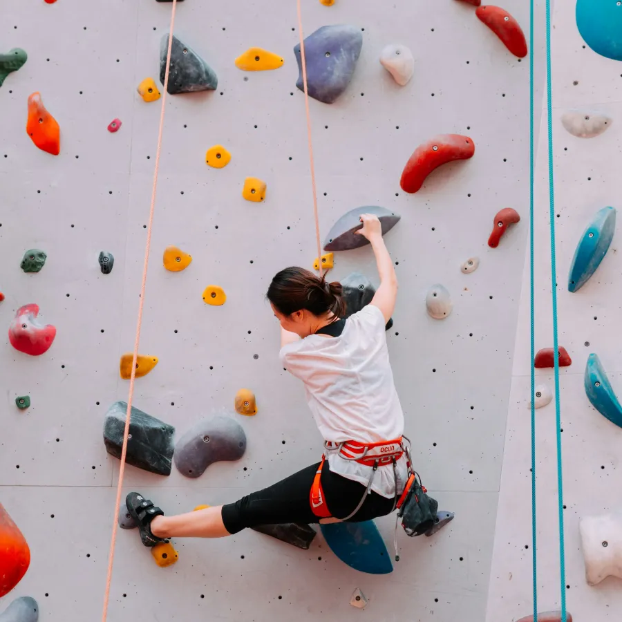 a person climbing a rock wall