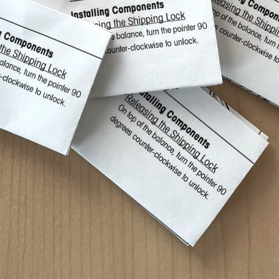 A pile of Miniature Folded Instructions