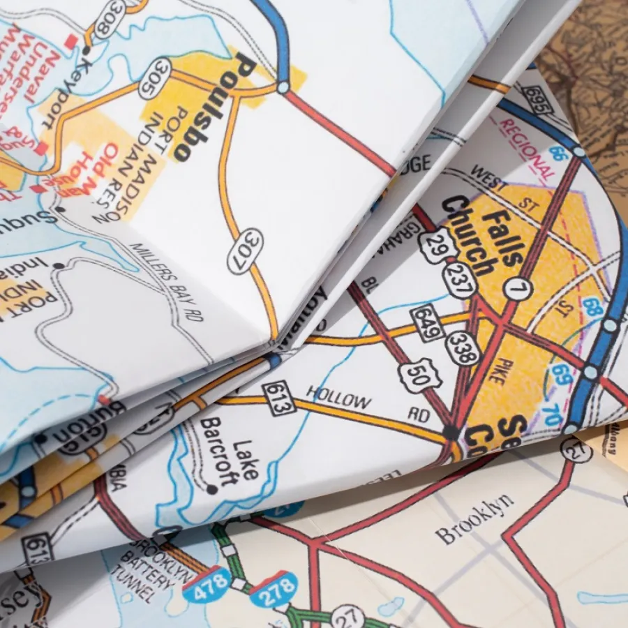 A stack of printed and folded Maps