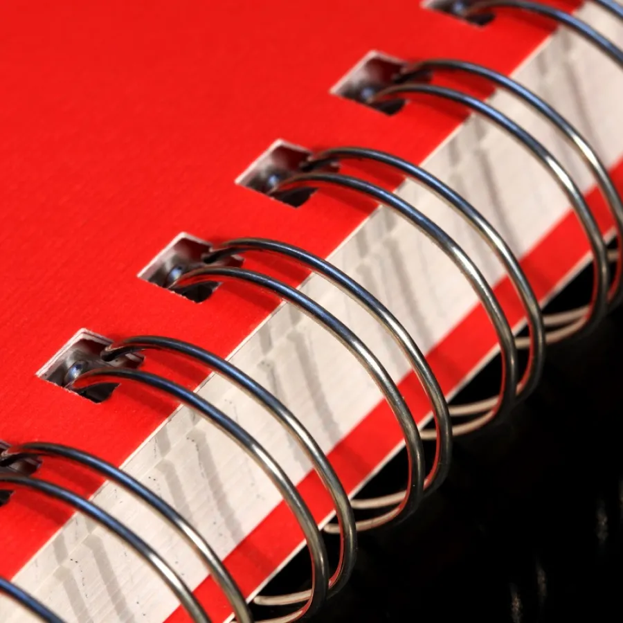 A red book with silver Wire-O Binding