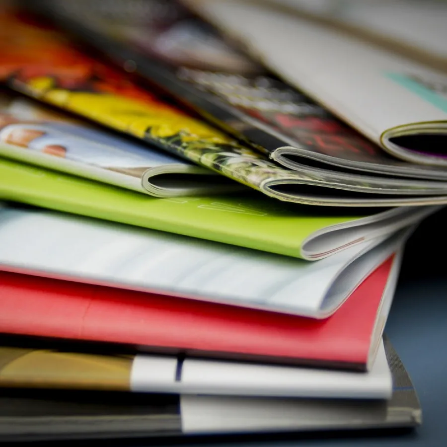 Colorful Saddle-Stitched Books on a Table