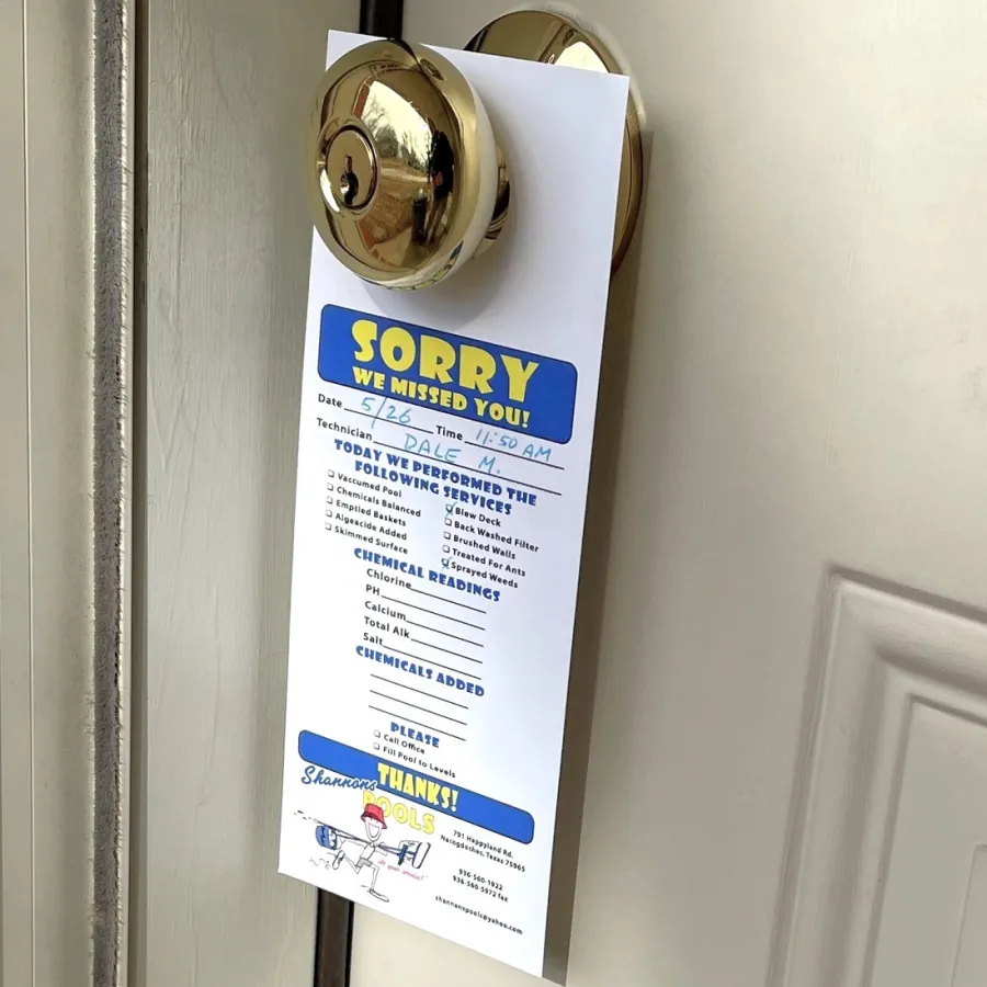 A printed Door Hanger on a gold door knob