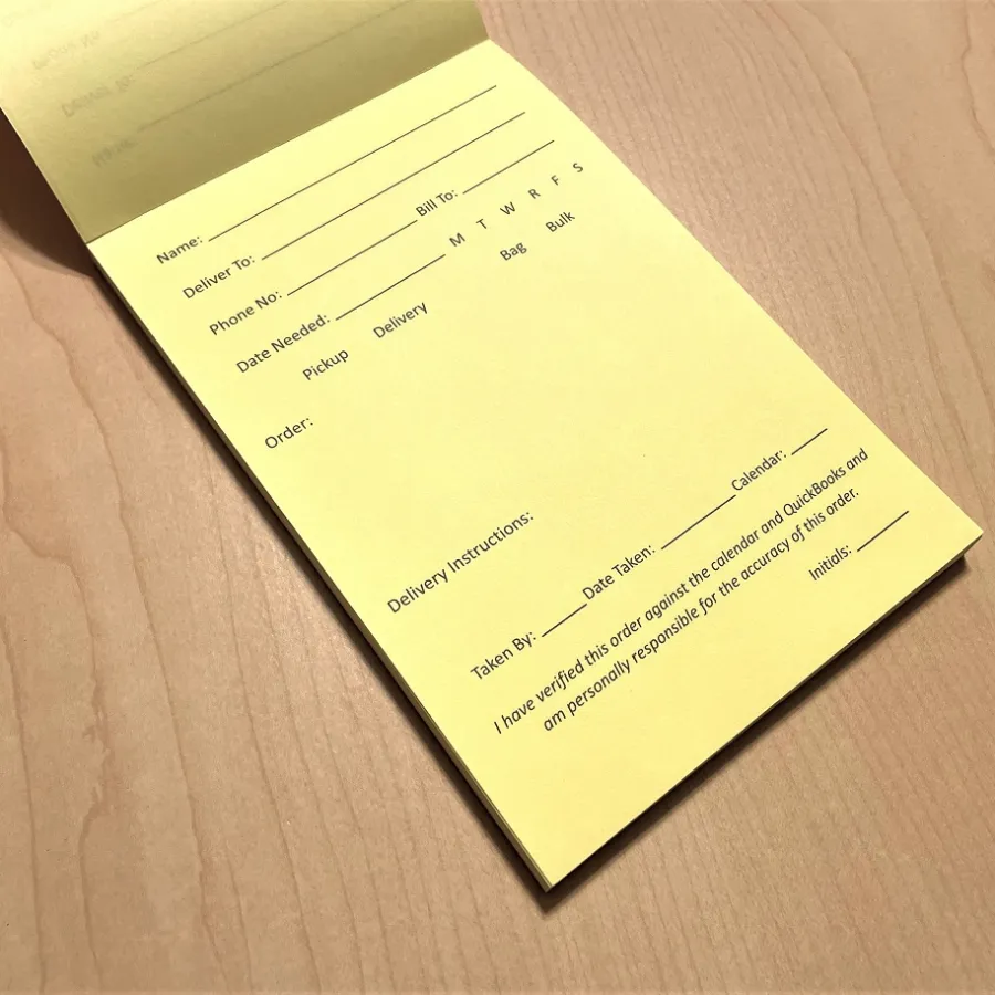 A pad of printed document on a desk
