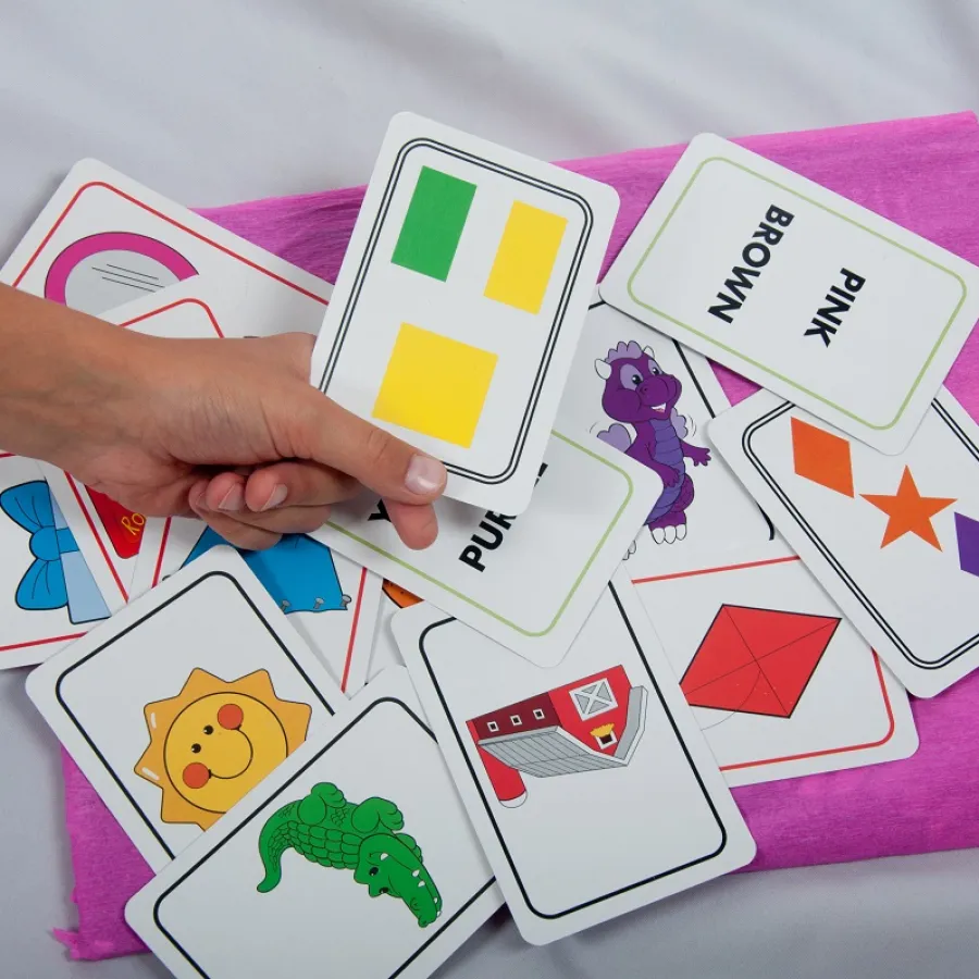 A child playing with a set of colorful Game Cards