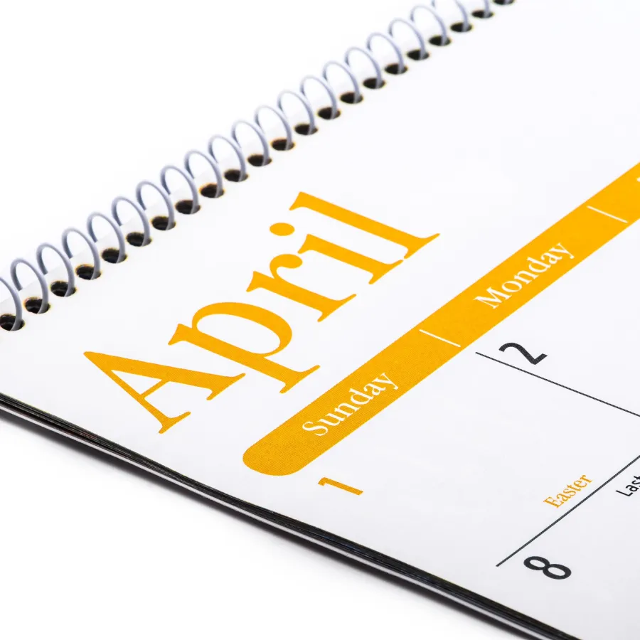 A Spiral Bound Calendar open to the month of April
