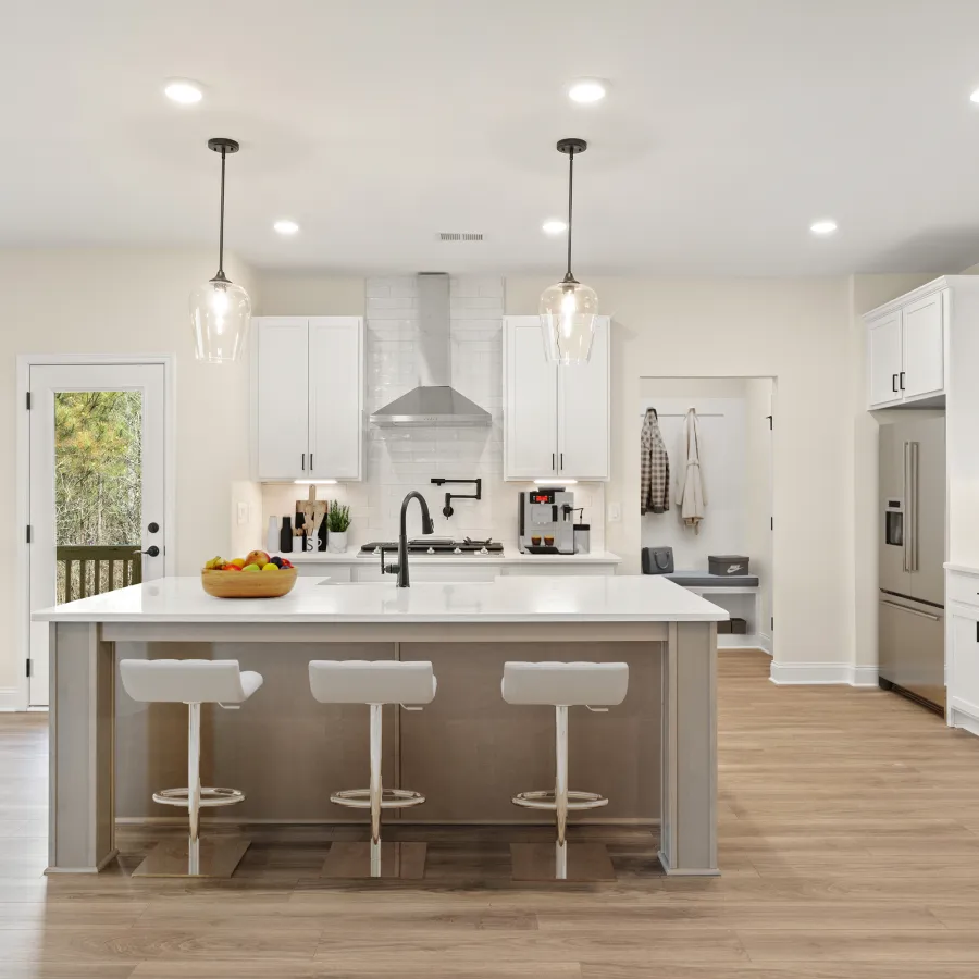 a kitchen with white cabinets