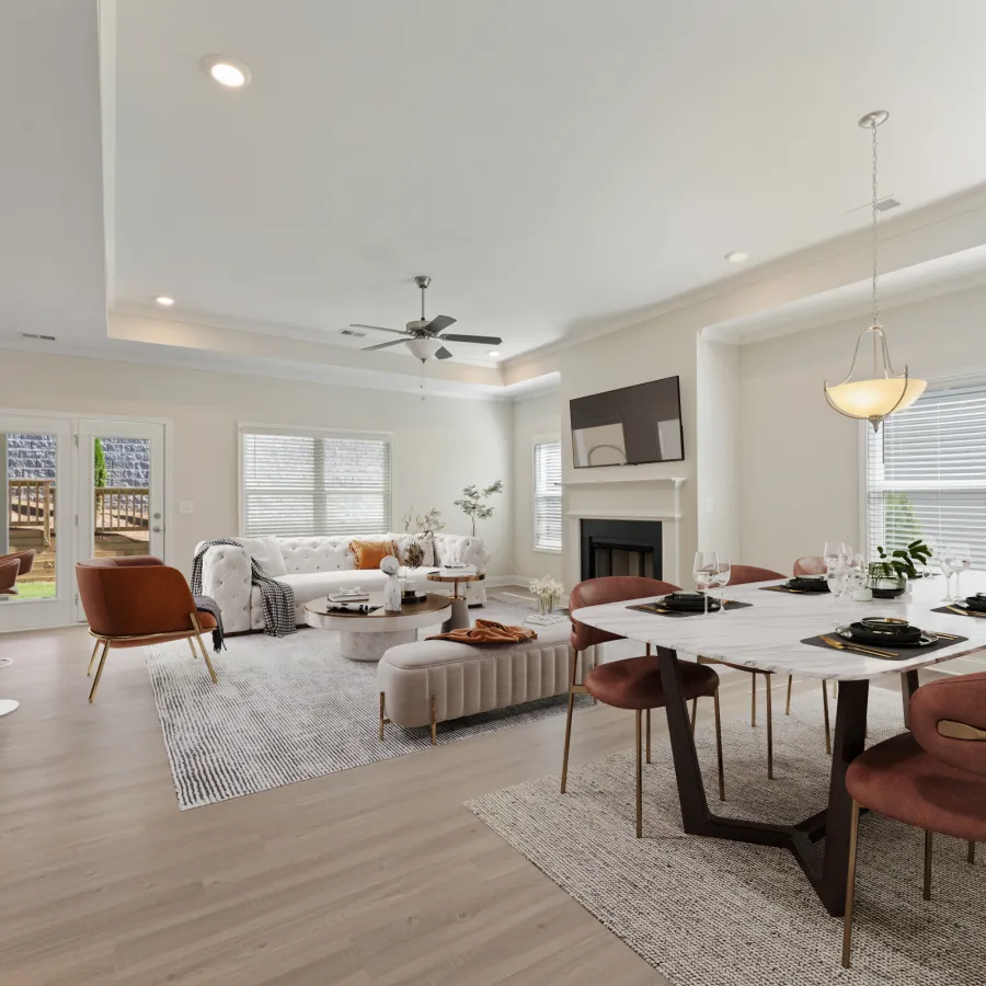 a large living room with a dining table and chairs