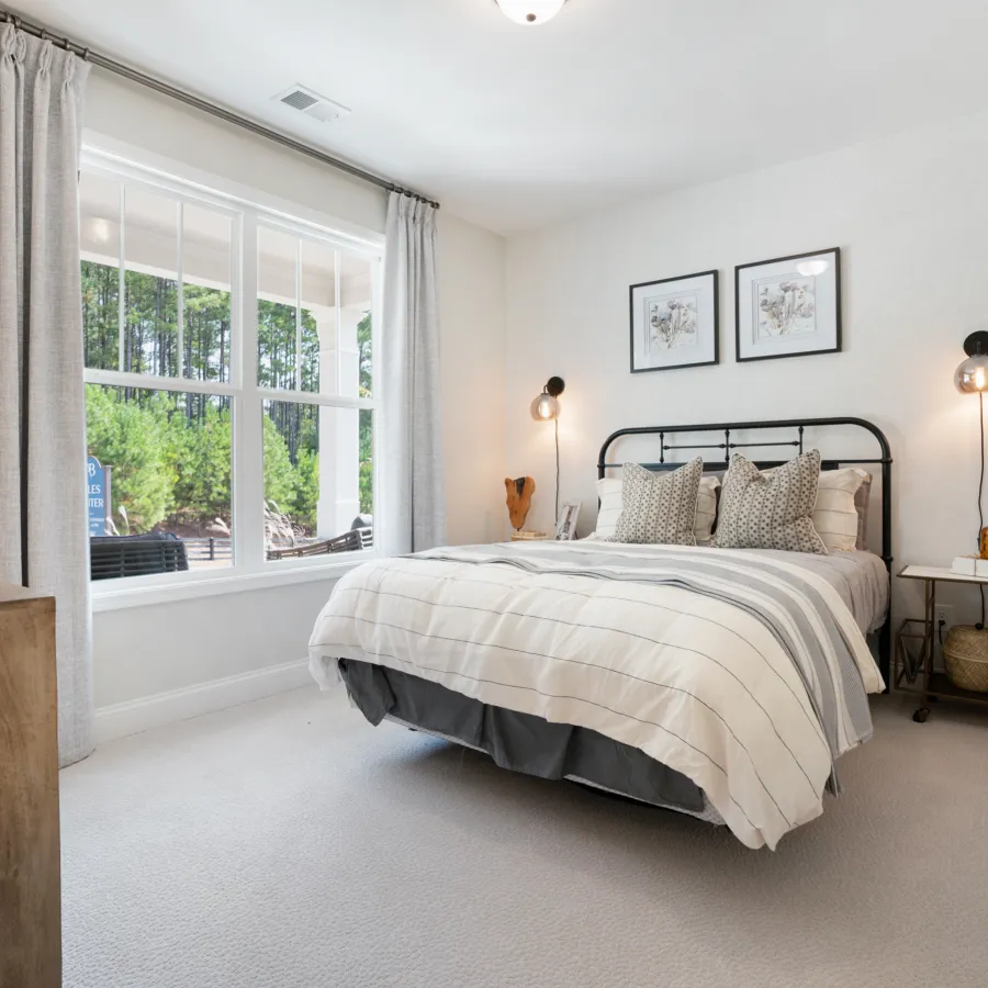 a bedroom with a large bed in a room