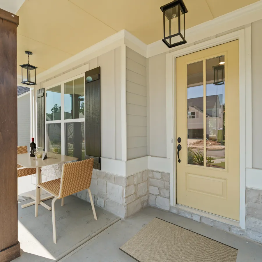 a patio with a table and chairs