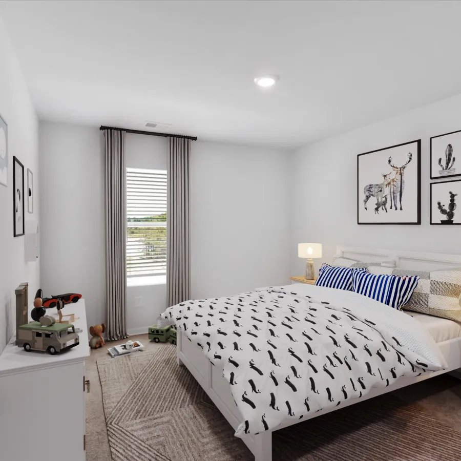 Bright bedroom with white furniture, patterned bedding, framed animal artwork, and soft lighting