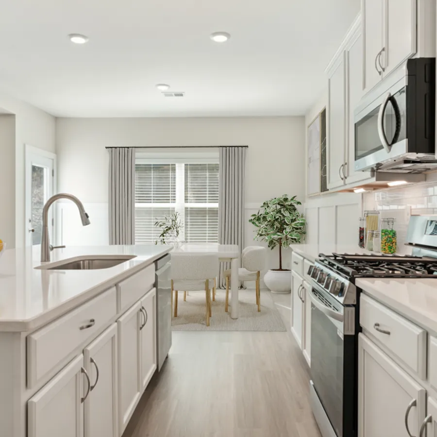a kitchen with white cabinets
