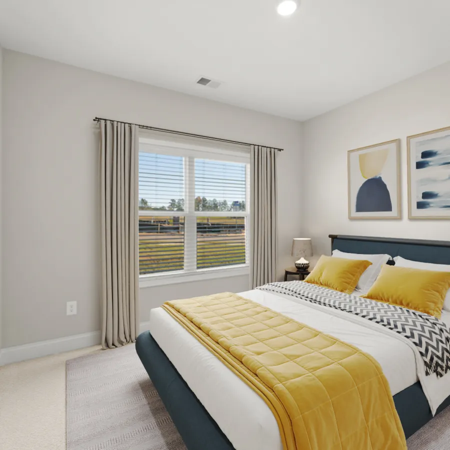 a bedroom with a large window