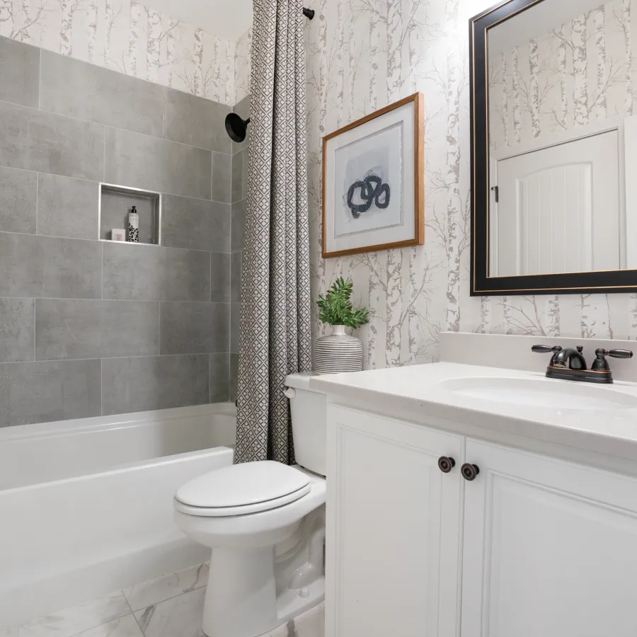 a bathroom with a tub sink and toilet