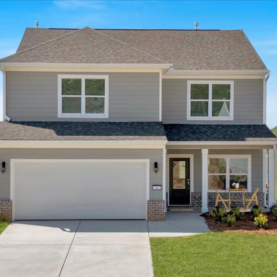 Charming two-story house with a green lawn and a clear blue sky background.