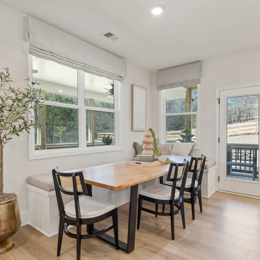 a dining room with a table and chairs