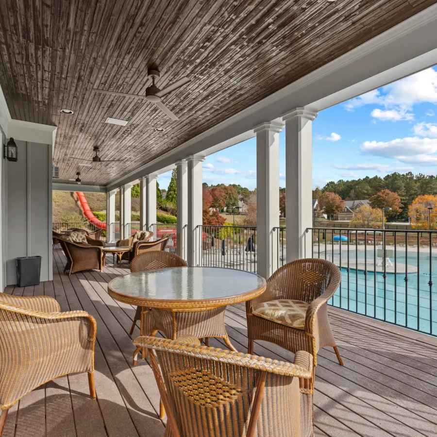 a deck with tables and chairs