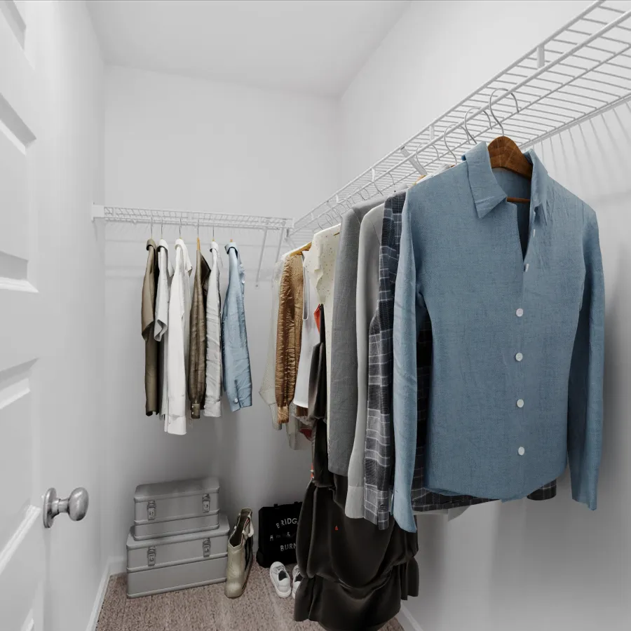 A stylish, organized closet featuring hanging clothes, storage boxes, and a clean, minimal design.