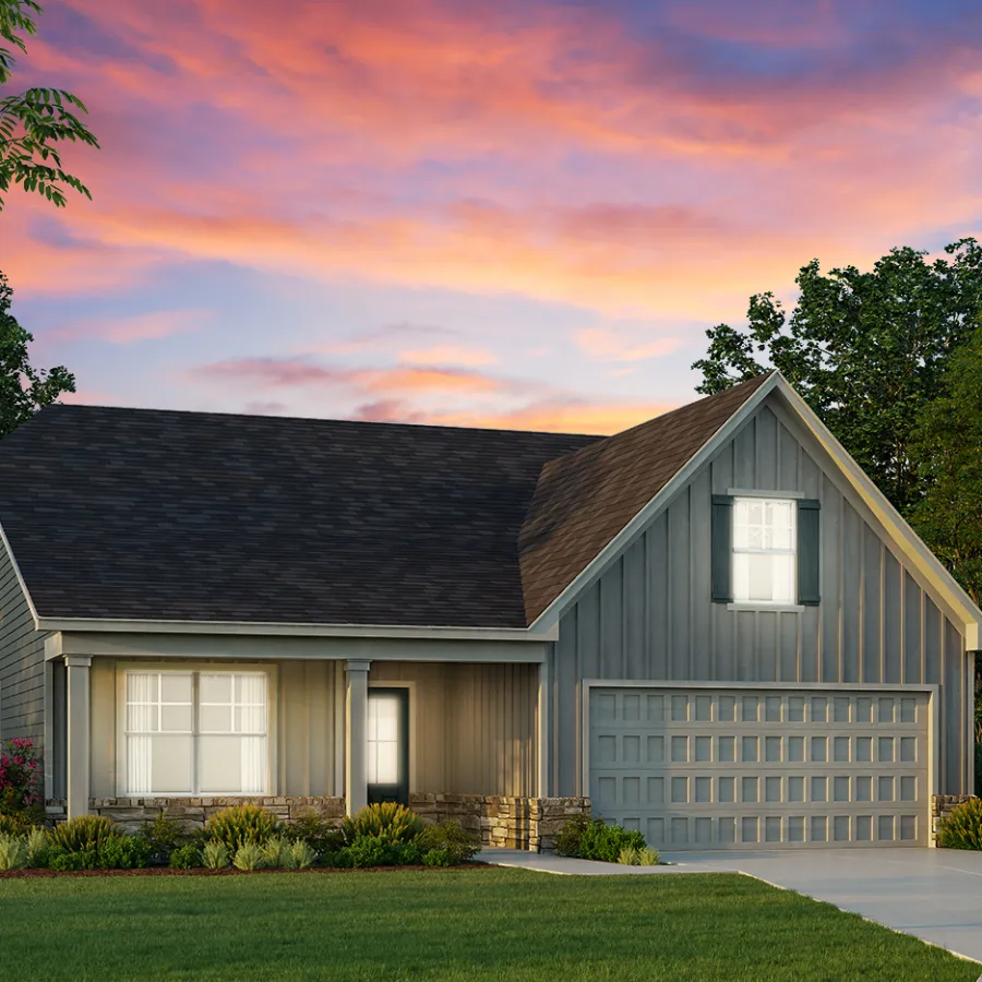 a house with a driveway and trees