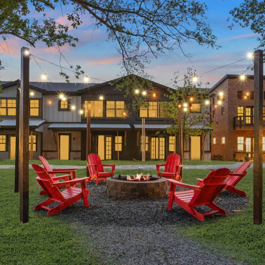 a building with a few tables and chairs outside