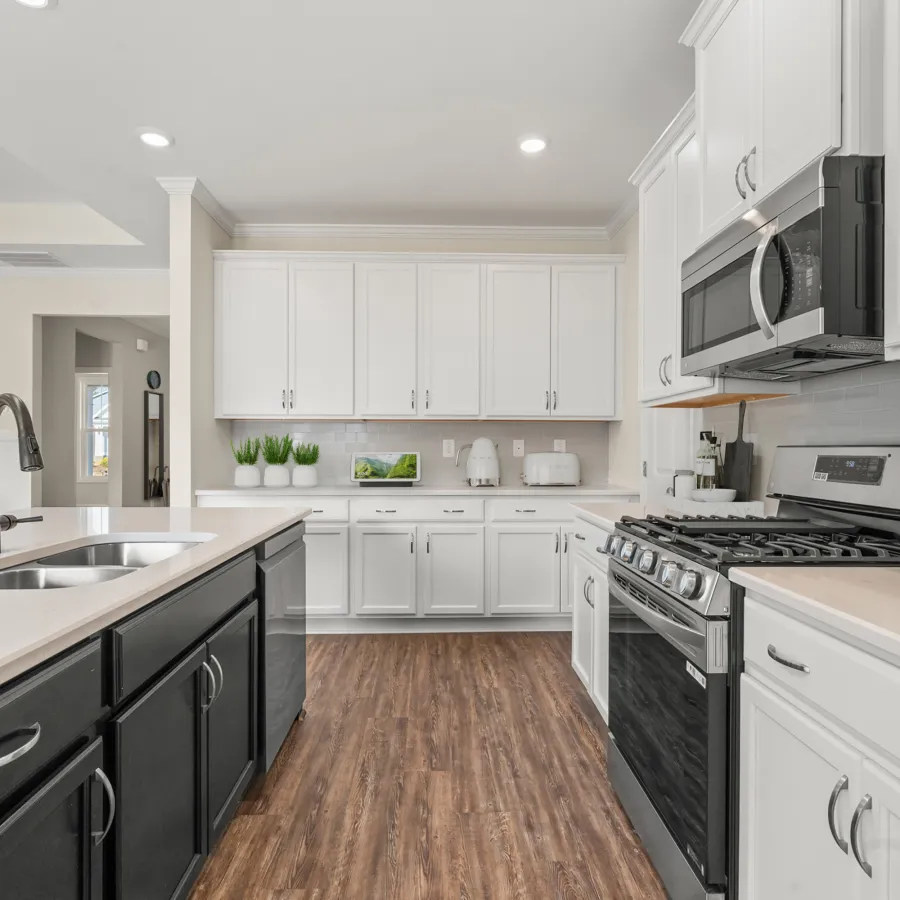 a kitchen with white cabinets