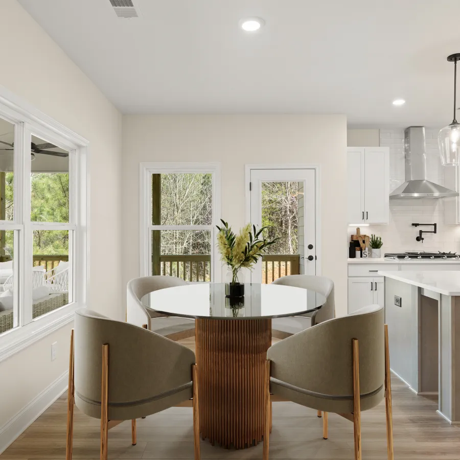 a kitchen with a table and chairs