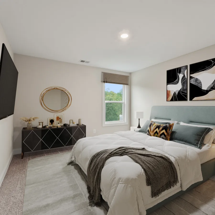 a bedroom with a bed and a mirror