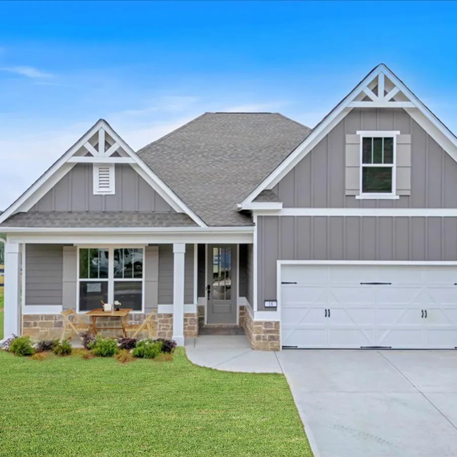 Modern single-story gray house with white trim, front porch, two-car garage, and green lawn under blue sky