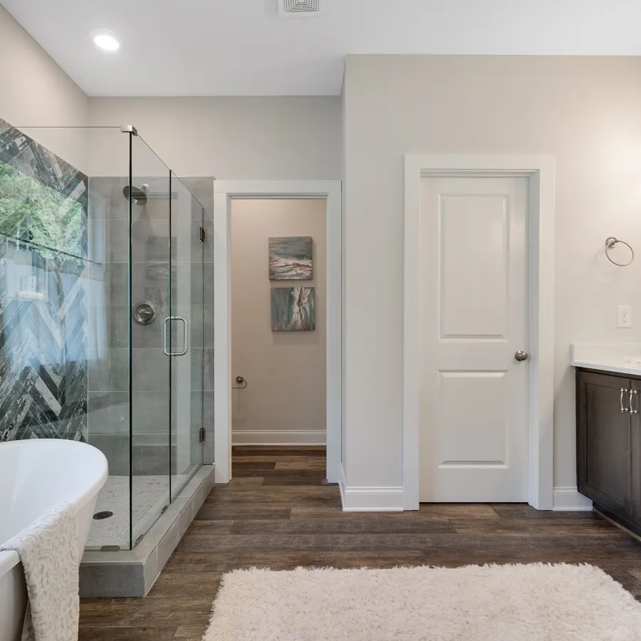 a large tub next to a sink